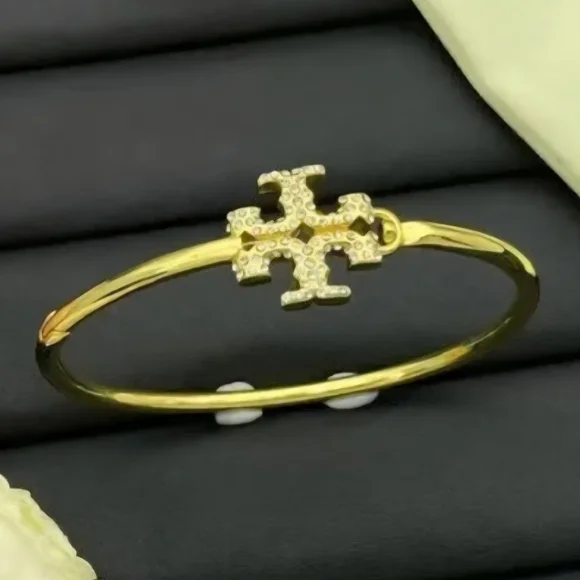 Tory Burch Gold Bangle with Crystal Emblem - Picture 1 of 4